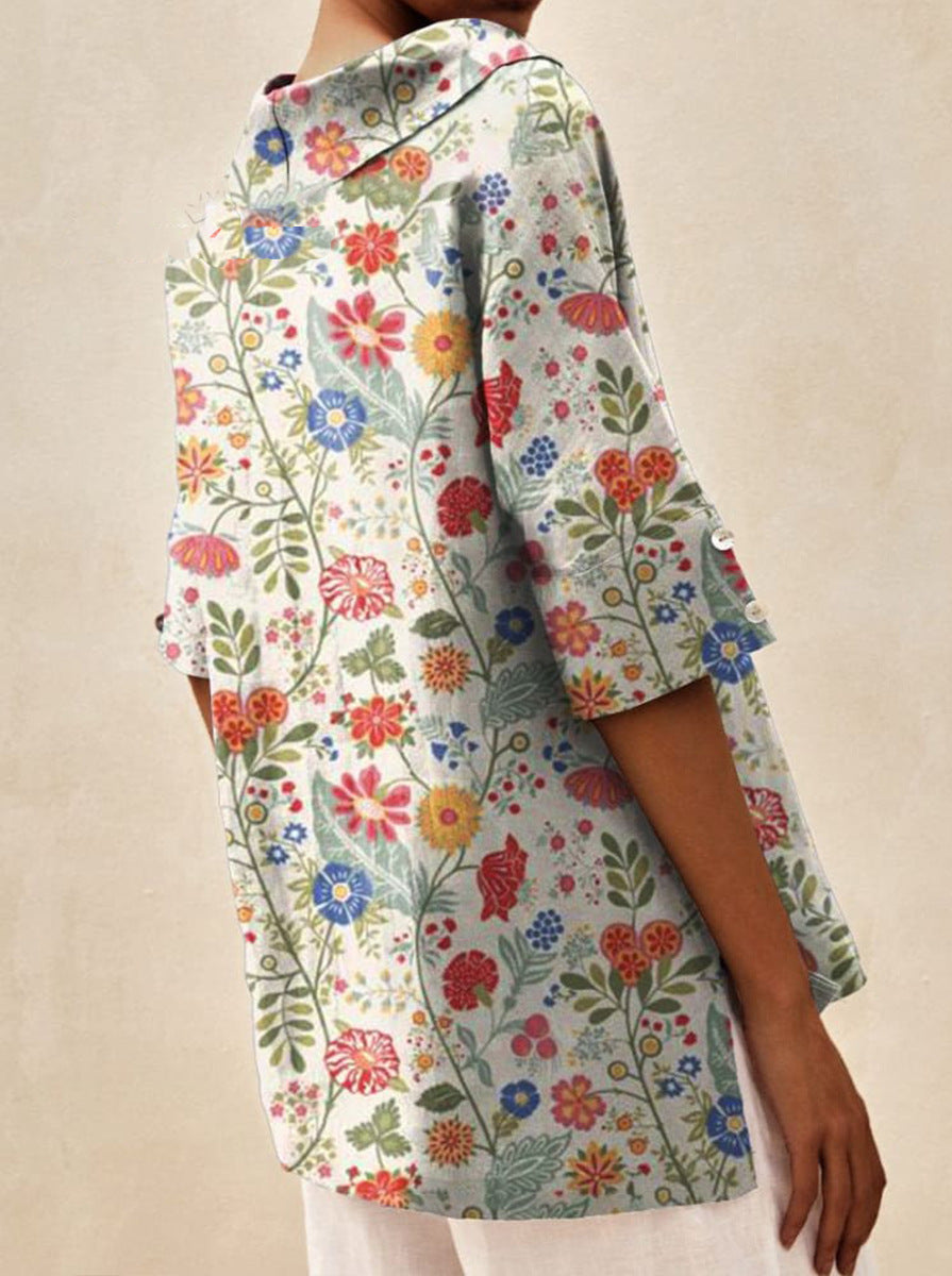 Auréa | Kortärmad blus med retroblommor och flip-krage