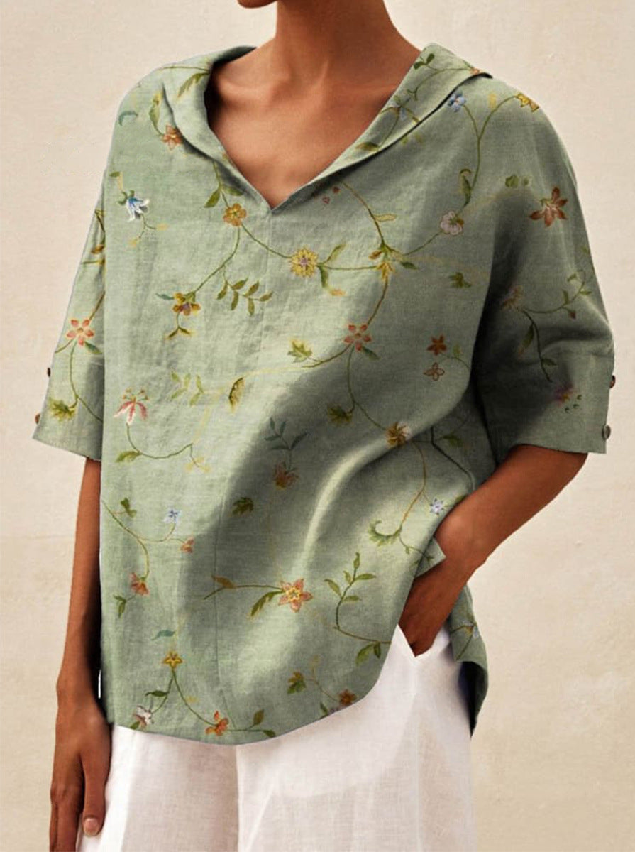Auréa | Kortärmad blus med retroblommor och flip-krage