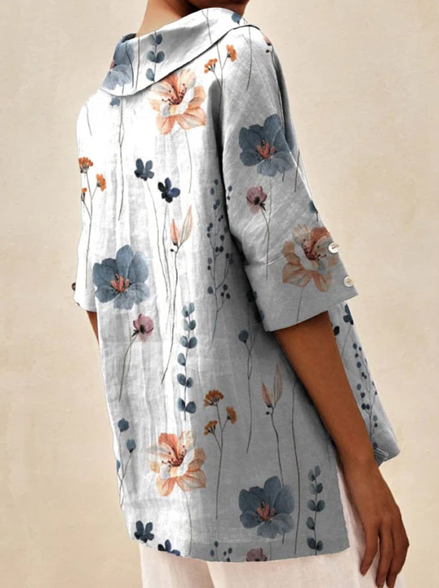 Auréa | Kortärmad blus med retroblommor och flip-krage