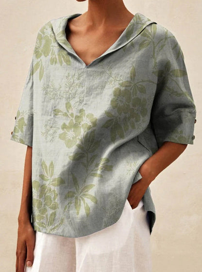 Auréa | Kortärmad blus med retroblommor och flip-krage
