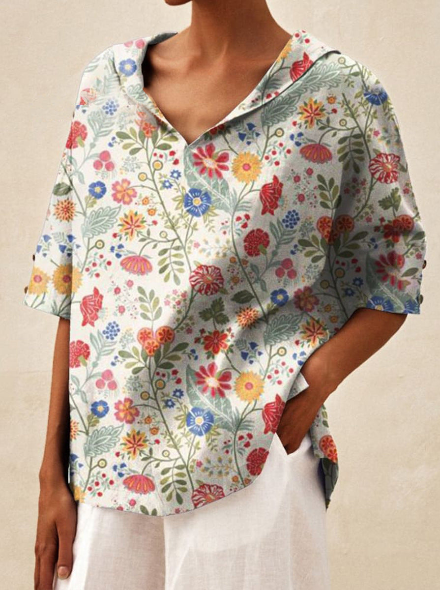 Auréa | Kortärmad blus med retroblommor och flip-krage